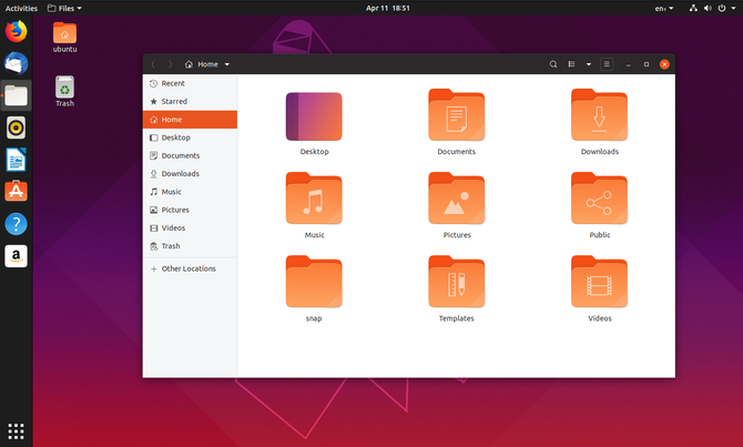 „Ubuntu 19.04“ failų tvarkyklė su darbalaukio piktogramomis fone