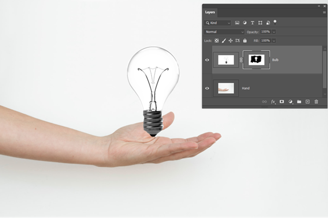 „Photoshop“ sluoksnio užmaskuotas rankos ir lemputės vaizdas